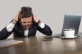 Stressed businessman feeling depressed and overwhelmed working at office computer desk tired and exhausted defeated by business f Royalty Free Stock Photo