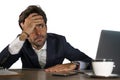 Stressed businessman feeling depressed and overwhelmed working at office computer desk tired and exhausted defeated by business f Royalty Free Stock Photo