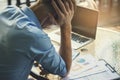 Stressed businessman,Frustrated and upset in business pressure and overworked at office.Adult caucasian male working on laptop, Royalty Free Stock Photo