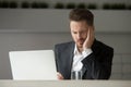 Stressed businessman having bad headache at work. Royalty Free Stock Photo