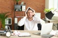 Stressed businessman missing deadlines in office Royalty Free Stock Photo