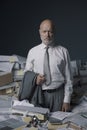 Stressed businessman overloaded with paperwork