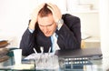 Stressed businessman sitting at desk Royalty Free Stock Photo