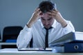 Stressed businessman sitting at desk Royalty Free Stock Photo