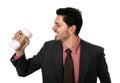 Stressed businessman in suit and tie crushing empty cup of take away coffee in caffeine addiction concept