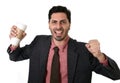 Stressed businessman in suit and tie crushing empty cup of take away coffee in caffeine addiction concept