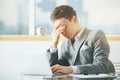 Stressed businessman using laptop Royalty Free Stock Photo