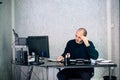 Stressed businessman working in his office Royalty Free Stock Photo