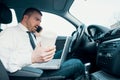 Stressed businessman working seated in car Royalty Free Stock Photo