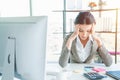 Stressed businesswoman doing paperwork at an office Royalty Free Stock Photo