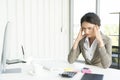 Stressed businesswoman doing paperwork at an office Royalty Free Stock Photo