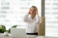 Stressed businesswoman having headache at work holding head in h Royalty Free Stock Photo