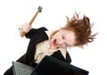 Stressed businesswoman smashing her laptop