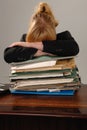 Stressed businesswoman - stack of paperwork