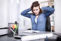 Stressed businesswoman under pressure