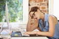 Stressed Businesswoman Working At Computer In Modern Office Royalty Free Stock Photo