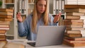 Stressed busy annoyed Caucasian student girl high school pupil woman stressful leaner studying with laptop and books Royalty Free Stock Photo