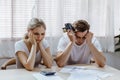 Stressed caucacian couple conclict of credit card bills or bebt of over expense in shopping. Lover financial risk or crisis and Royalty Free Stock Photo