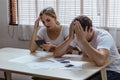 Stressed caucacian couple conclict of credit card bills or bebt of over expense in shopping. Lover financial risk or crisis and Royalty Free Stock Photo