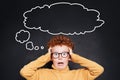 Stressed child with empty speech clouds bubbles