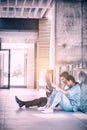 Stressed doctor and nurse sitting on floor examining X-ray report Royalty Free Stock Photo