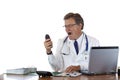 Stressed doctor in office screams into telephone Royalty Free Stock Photo