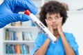 Stressed doctor with test tube of Omicron variant Royalty Free Stock Photo