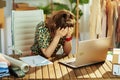 Stressed elegant small business owner woman in office