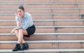 stressed employee, businesswoman, holding his forehead in stress After fired from work and failed in busines