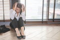 Stressed employee, businesswoman, holding his forehead in stress After fired from work and failed in business,She was heartbroken