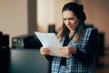 Businesswoman Struggling to Read Fine Print in a Contract Royalty Free Stock Photo