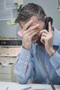 Stressed employee on the phone