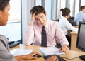 Stressed Employee Working In Busy Office Royalty Free Stock Photo