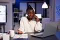 Stressed exhausted african american businesswoman talking with manager Royalty Free Stock Photo