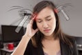 Stressed exhausted asian woman having strong tension headache. Royalty Free Stock Photo