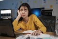 Young woman working on laptop in the office. Royalty Free Stock Photo