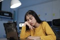 Young woman working on laptop in the office. Royalty Free Stock Photo