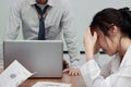 Stressed exhausted young Asian business woman suffering from severe depression between meeting in office. Royalty Free Stock Photo