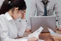 Stressed exhausted young Asian business woman suffering from severe depression between meeting in office. Royalty Free Stock Photo