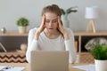 Stressed exhausted young woman tired from computer work feeling fatigue Royalty Free Stock Photo