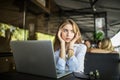 Stressed female student having headache touching temples preparing for test in cafe. Frustrated millennial girl feels nervous or t Royalty Free Stock Photo