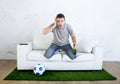 Stressed football fanatic fan watching game on tv nervous in disbelief face as if disaster comes Royalty Free Stock Photo