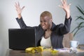 Stressed and frustrated afro American black woman working overwhelmed and upset at office laptop computer desk gesturing angry in