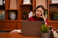 Stressed and frustrated Asian businesswoman suffering from headache Royalty Free Stock Photo