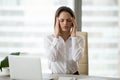 Stressed frustrated female employee feeling headache or migraine Royalty Free Stock Photo