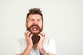 Stressed furious bearded man shouting. Face expression. Negative emotions, problems. Feeling angry Royalty Free Stock Photo