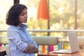 Stressed hipster businesswoman working on laptop in her office Royalty Free Stock Photo