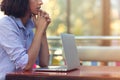 Stressed hipster businesswoman working on laptop in her office Royalty Free Stock Photo