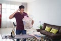 stressed husband busy with house work, irones his shirt in morning