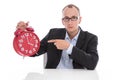 Stressed isolated businessman pointing at clock. 4 o'clock after